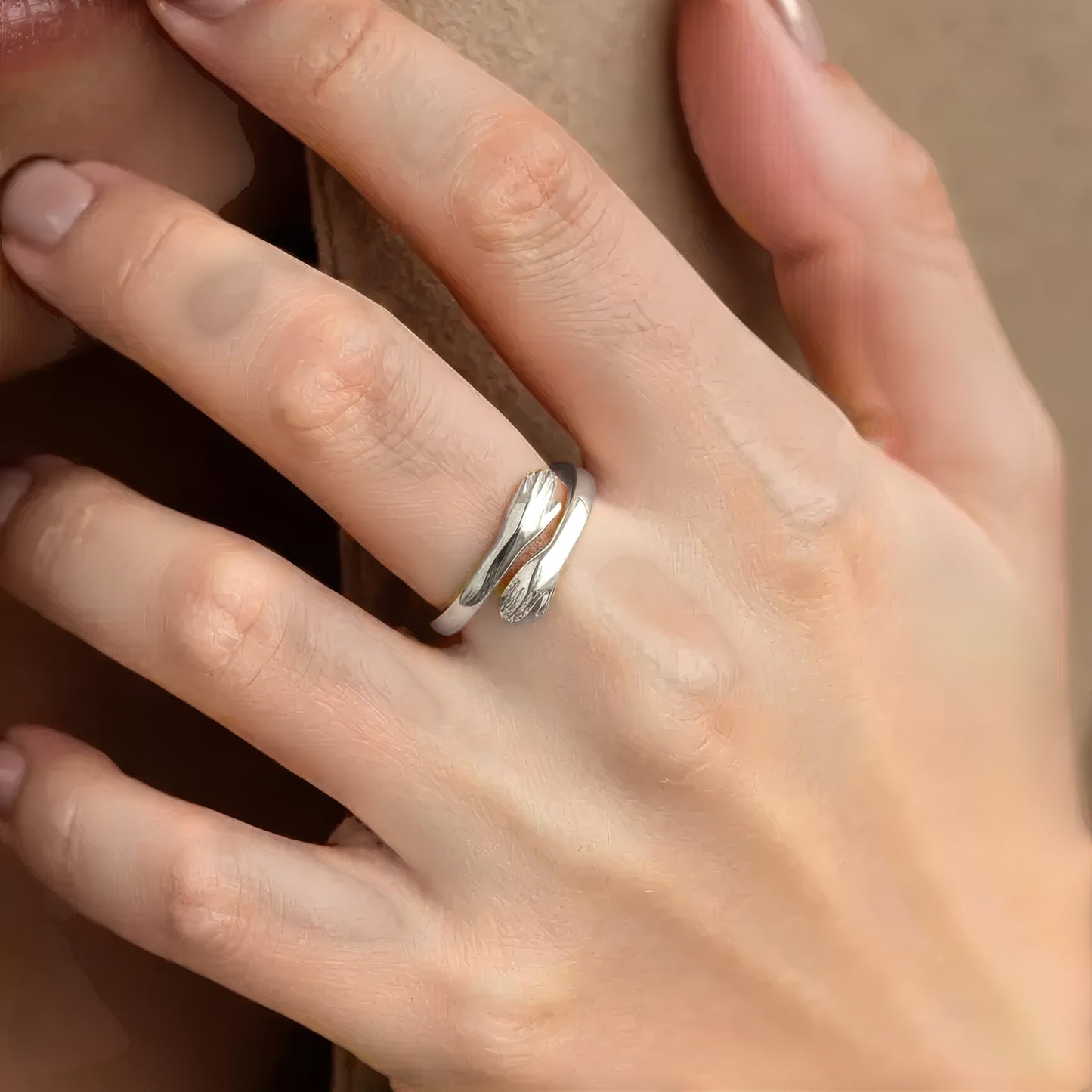 Vielring sterling silver open hug ring symbolizing love and connection, adjustable fit.