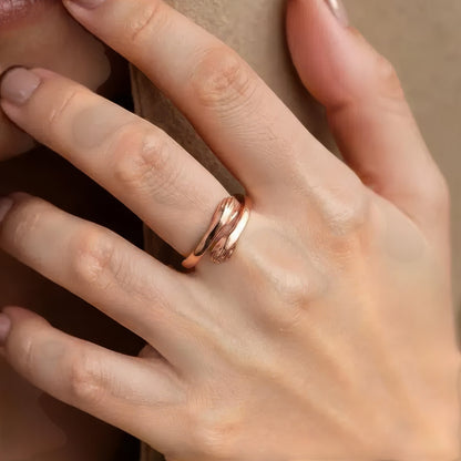 Vielring rose gold hug ring symbolizing love and connection, made of 925 sterling silver with adjustable fit.